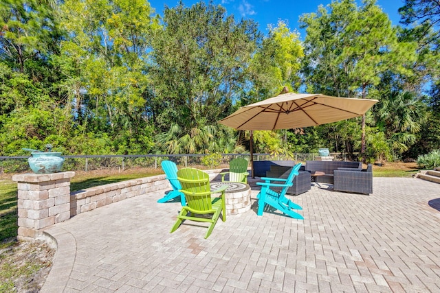 view of patio / terrace featuring an outdoor living space with a fire pit