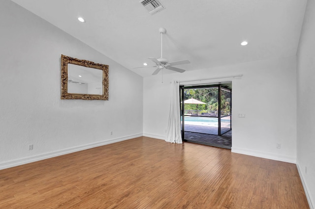 empty room with ceiling fan, light hardwood / wood-style floors, and lofted ceiling