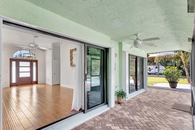 view of patio featuring ceiling fan