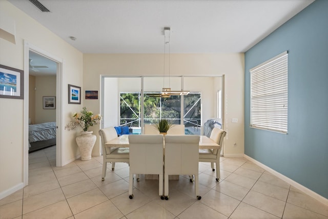 dining area with light tile patterned flooring