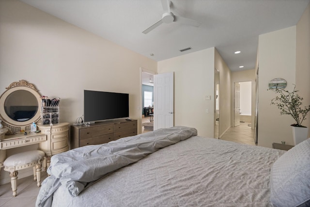 tiled bedroom featuring ceiling fan