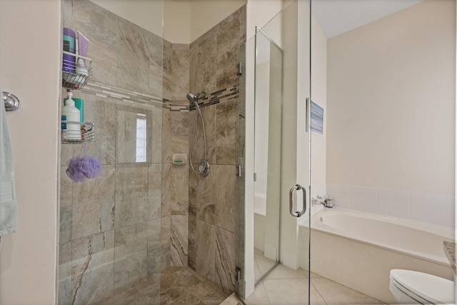 bathroom with plus walk in shower, tile patterned floors, and toilet