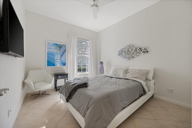 bedroom with ceiling fan, light tile patterned floors, and vaulted ceiling