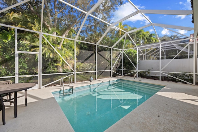 view of pool featuring a lanai and a patio area