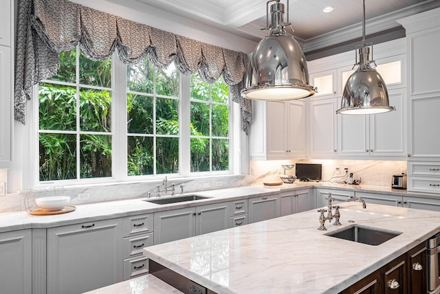 kitchen with light stone counters and sink