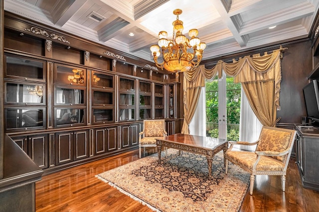 sitting room with a notable chandelier, dark hardwood / wood-style flooring, coffered ceiling, and ornamental molding