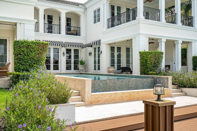 view of pool featuring french doors