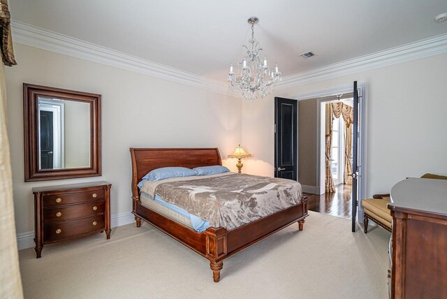 carpeted bedroom featuring an inviting chandelier and crown molding