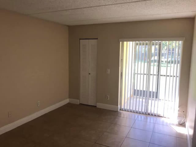 view of tiled empty room