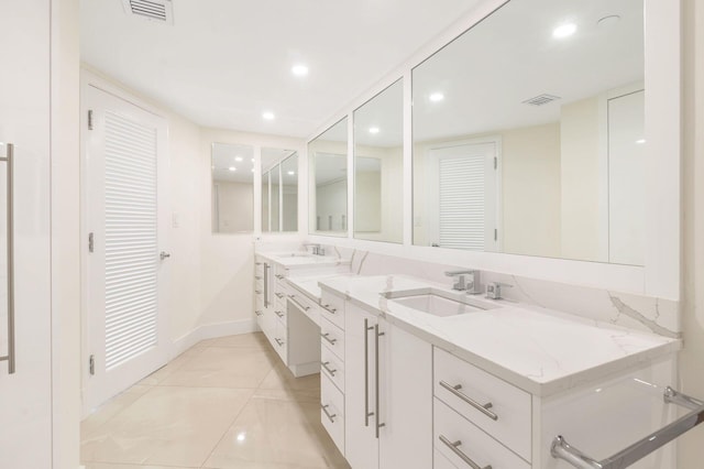 bathroom with vanity and tile patterned floors