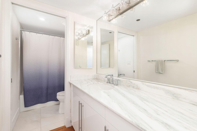 full bathroom featuring tile patterned floors, vanity, toilet, and shower / tub combo with curtain