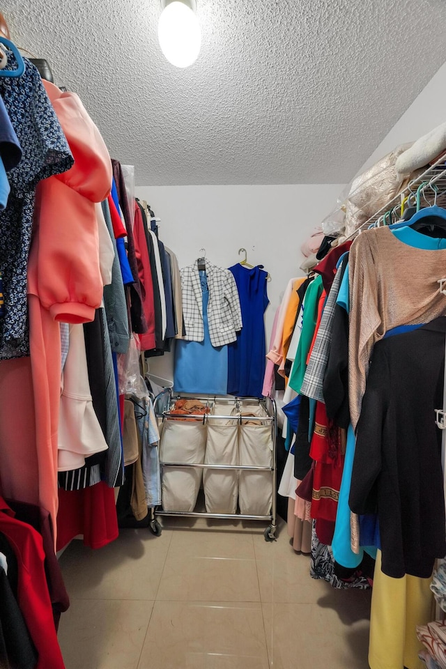 walk in closet featuring light tile patterned floors