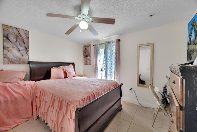 bedroom featuring light tile patterned floors, a textured ceiling, and ceiling fan