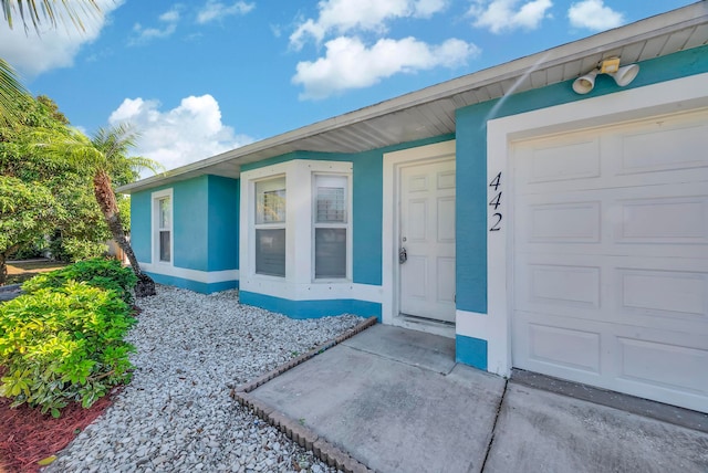 entrance to property featuring a garage