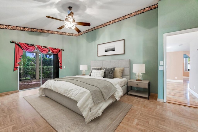 bedroom featuring access to exterior, light parquet flooring, and ceiling fan