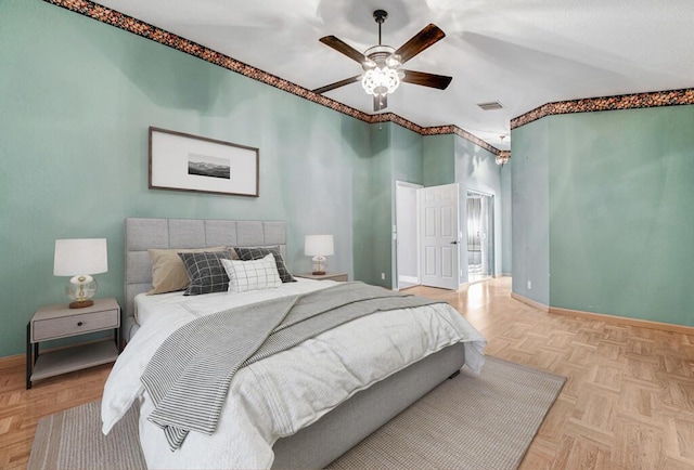 bedroom with ceiling fan and light parquet floors