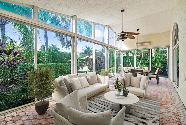 sunroom / solarium featuring ceiling fan