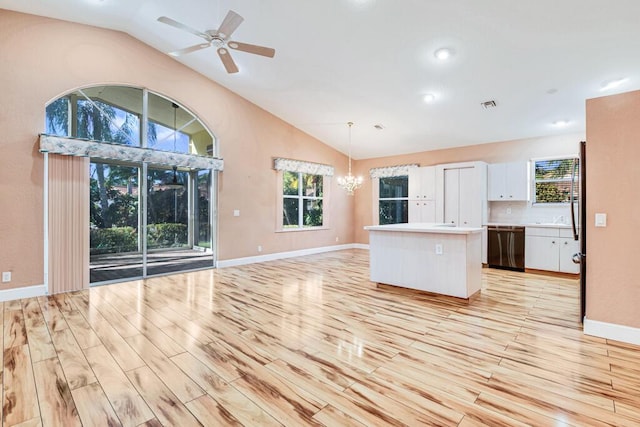 unfurnished living room featuring ceiling fan, light hardwood / wood-style floors, and vaulted ceiling