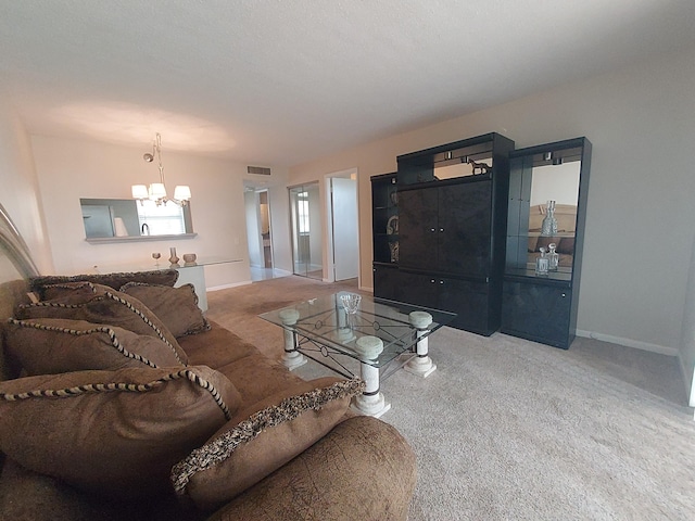 living area with carpet, visible vents, baseboards, and an inviting chandelier