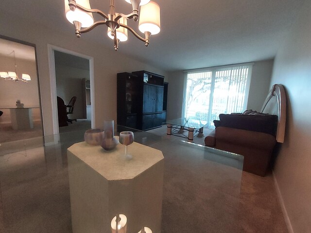 living room featuring carpet and a chandelier