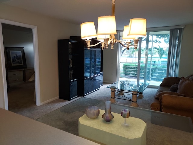 carpeted living room featuring a notable chandelier