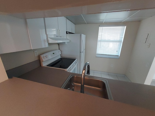 kitchen featuring a drop ceiling, sink, white cabinetry, and white electric stove