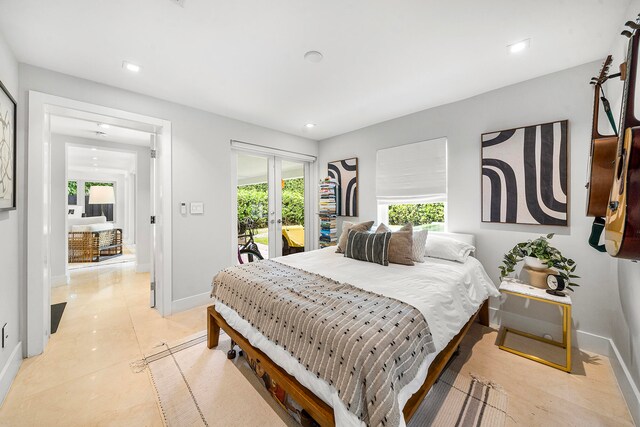 bedroom with access to exterior and light tile patterned floors