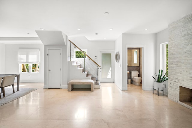 foyer featuring a fireplace