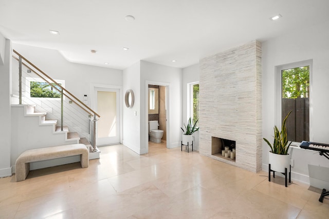 foyer featuring a fireplace