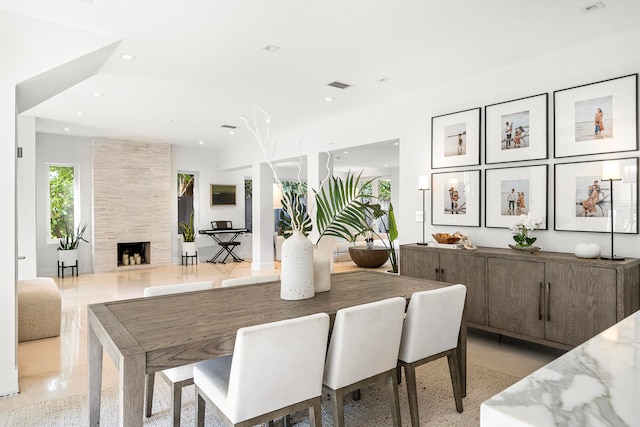 dining space with a fireplace