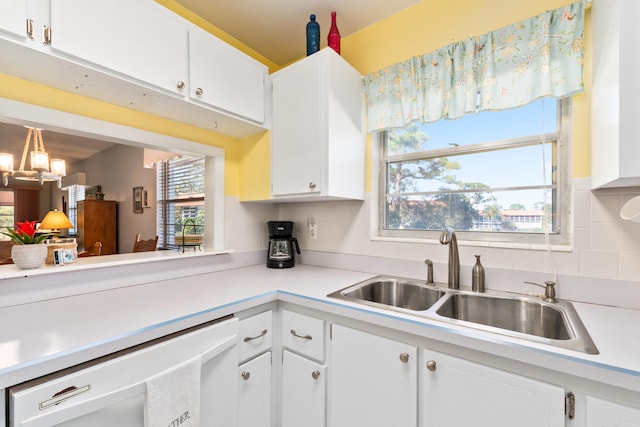 kitchen featuring sink, white cabinets, and a healthy amount of sunlight