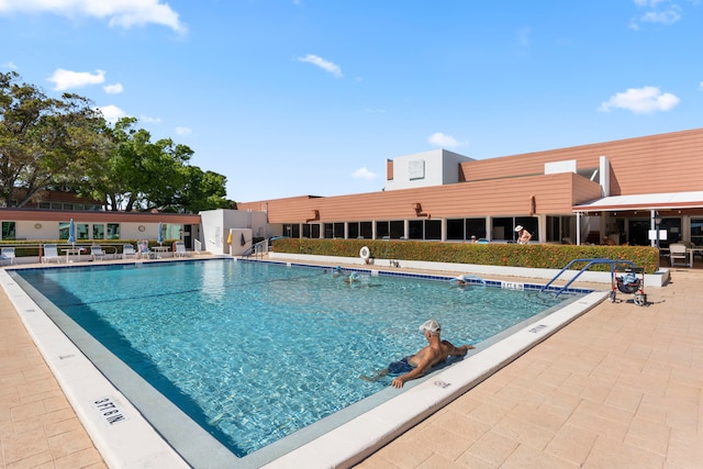 view of pool featuring a patio area