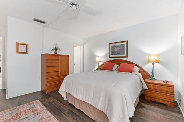 bedroom featuring dark hardwood / wood-style floors and ceiling fan