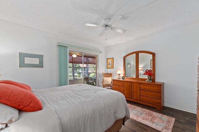 bedroom featuring a textured ceiling, ceiling fan, and dark wood-type flooring