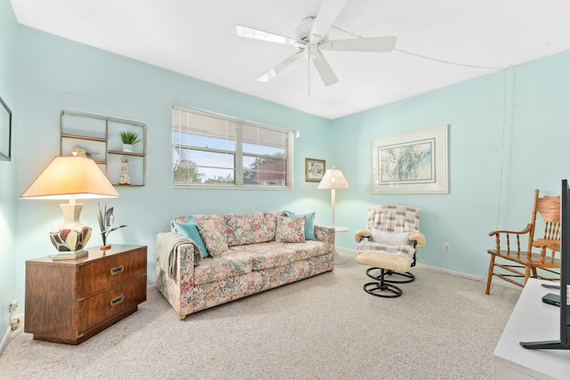 living room with ceiling fan and light carpet