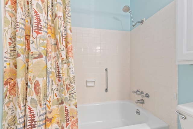 bathroom featuring toilet and shower / bath combo with shower curtain