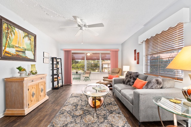 living room featuring a textured ceiling and dark hardwood / wood-style floors