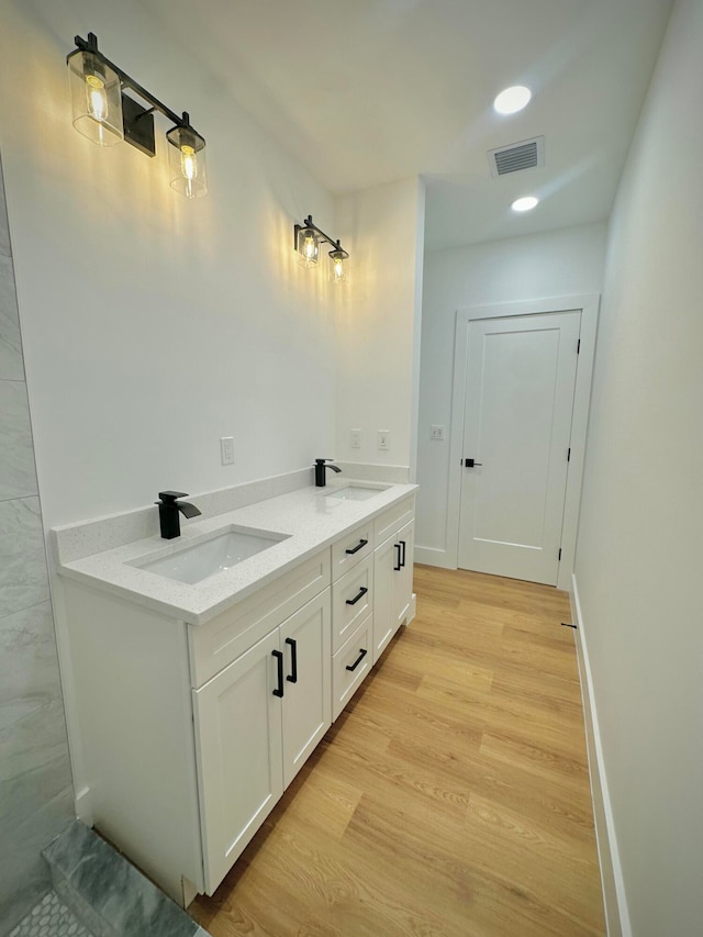 bathroom featuring hardwood / wood-style floors and vanity