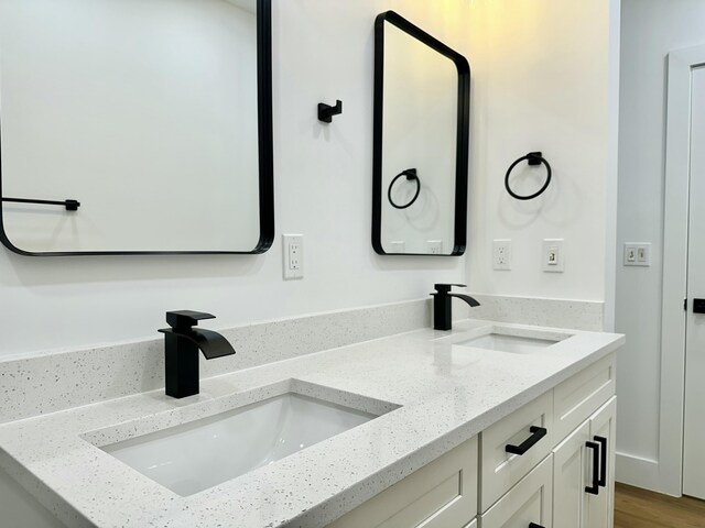 full bathroom with vanity, hardwood / wood-style flooring, toilet, and tiled shower / bath combo