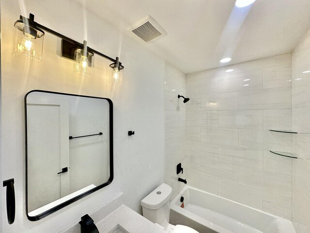 full bathroom with shower / washtub combination, visible vents, and toilet