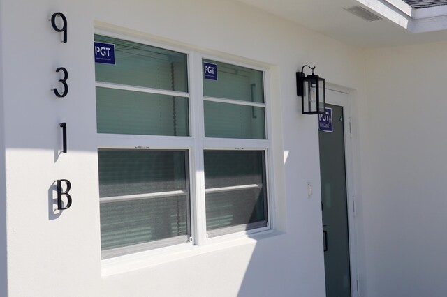 exterior details featuring stucco siding