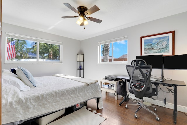 bedroom with ceiling fan and hardwood / wood-style floors