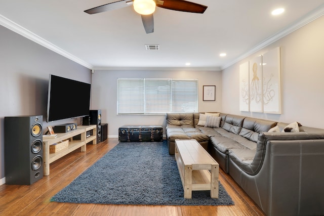 living room featuring crown molding, ceiling fan, and wood-type flooring