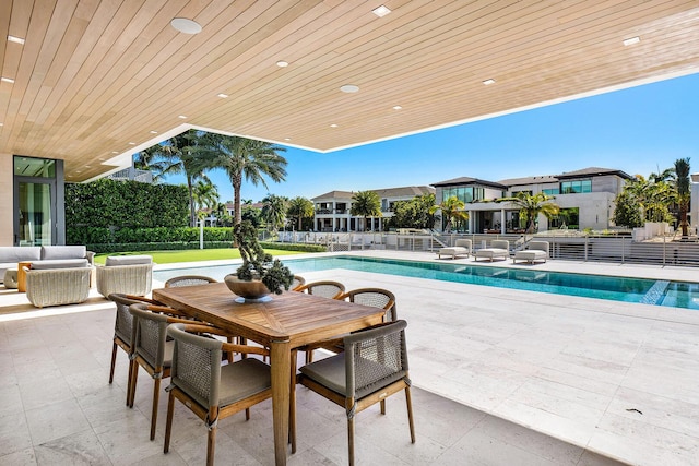 view of swimming pool featuring an outdoor living space and a patio