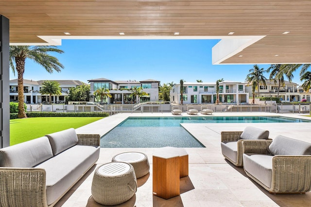 view of swimming pool with an outdoor living space and a patio area