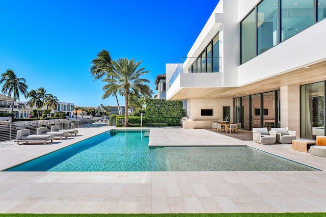 view of pool featuring a patio area