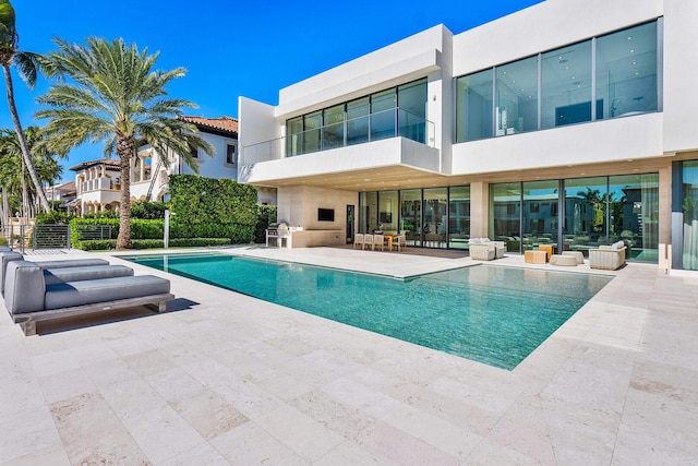 view of swimming pool featuring a patio area