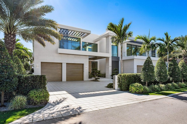 view of front of house with a balcony and a garage