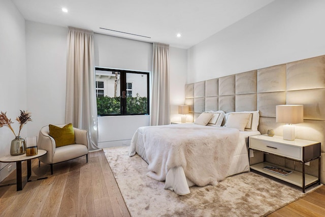 bedroom with wood-type flooring