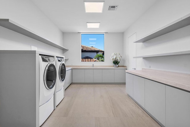 224 W Key Palm Rd, Boca Raton, FL 33432 - washroom with washing machine and clothes dryer and cabinet space